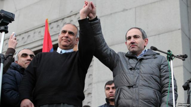 Armenia - Opposition leaders Raffi Hovannisian (L) and Nikol Pashinian greet protesters in Yerevan's Liberty Square, 20Feb2013.